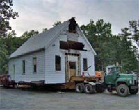 Springfield Baptist Church, dismantled building being moved on a flatbed truck from Henrico County, Virginia to Goochland County, Virginia.