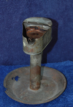 An early whale oil lamp.