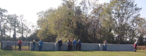 The surrounding wall of the cemetery was straightened and coated.