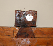 One of the mortised joints with the tag attached during disassembly and left exposed by Mr. Cluff to illustrate details of Springfield farmhouse construction.
