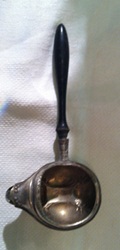 Decorated silver invalid feeder with wooden handle from 1800s.