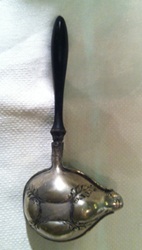 Decorated silver invalid feeder with wooden handle from 1800s.