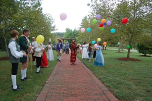 Colonial Dance Company greeting visitors entering the grounds.