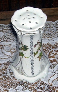 What Do You Know object is a porcelain object with perforations in the top and just over 5 inches tall.