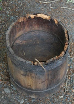 Bottom section of wooden semi-conical container..